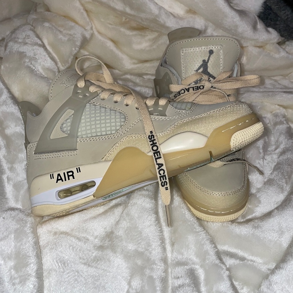 Nike Off White Jordan 4s selling because they are a 1/2 size too small.